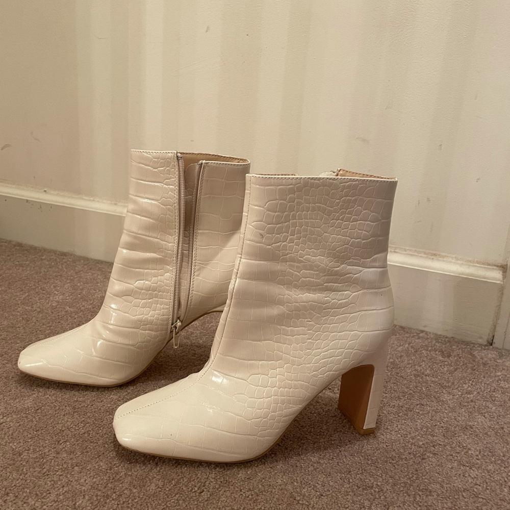 White faux leather snake print heeled boots